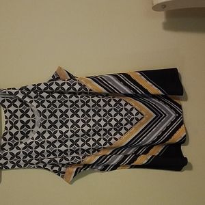 A two piece set,  sleeveless top  with an optional cardigan added.